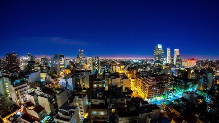 Wall Mural - Night time-lapse view on the illuminated skyline of the city in Buenos Aires, Argentina.
