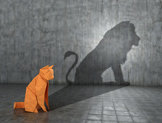 concept of hidden potential. a paper figure of a cat that fills the shadow of a lion. 3d illustratio
