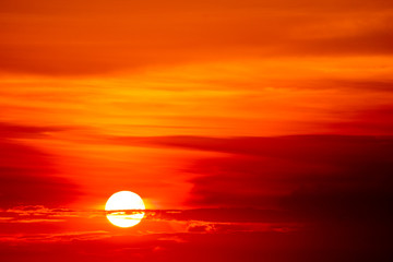 Wall Mural - last light sunset on sky orange cloud ray around sun