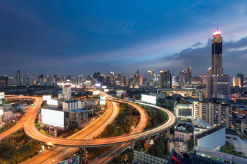 Cityscape view of Bangkok city central business downtown with expressway at twilight