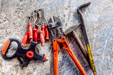 Poster - Construction tool. Construction concept. The tool lies on a granite stone.