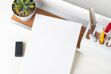 Poster - Top view white paper note on modern office stationery on white table.pencil, notepad,ruler,pen and pencil box with plant.Mock up paper note for display of design or content,