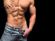 © Stavros - Muscular male torso isolated on black background.