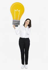 Canvas Print - Thoughtful woman with a light bulb icon