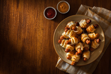 Canvas Print - Pigs in blankets. Dark mood