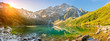 Leinwandbild Motiv Tatra National Park, a lake in the mountains at the dawn of the sun. Poland