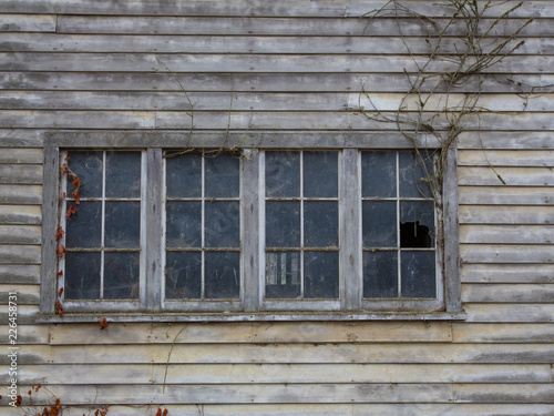 Isolated Partial View Of Old Weathered Grey Wooden Barn With Pane