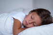 © Kitreel - Portrait of a young girl (kid) sleeping on the bed. Concept: Relax, family