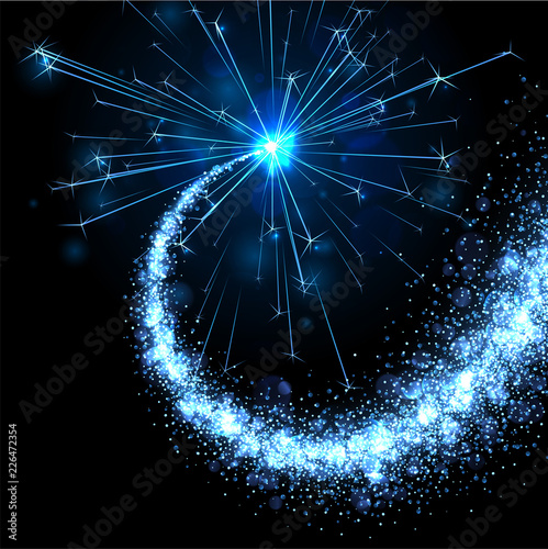 Fotografija Blue sparkling petard or firework on black background.