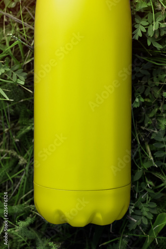 Download Stainless Thermos Water Bottle Light Lemon Color Light Yellow Mockup Isolated On Green Grass Background With Sunlight Effect Glossy Aluminum Vacuum Thermo Tumbler Flask Buy This Stock Photo And Explore Similar Yellowimages Mockups
