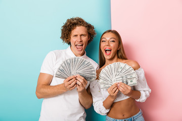 Wall Mural - Excited young couple standing