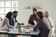 © LStockStudio - Group of Businesspeople at Meeting Room