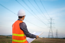 Engineering Worker Checking Location Site Near To High Voltage Tower.