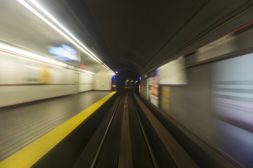 Wall Mural - blurred high speed motion of a train travelling through a tunnel