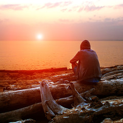 Wall Mural - Lonely Young Man at Seaside