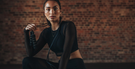 Woman resting after workout at gym