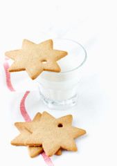 Sticker - Gingerbread cookies and a Glass of Milk. Christmas time. White background. Close up. Copy space.  