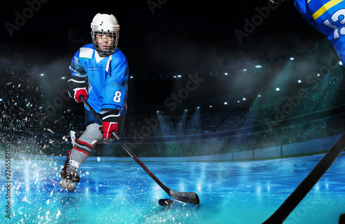 Fototapeta na szkło Hockey player passing the puck during competition