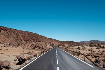 Wall Mural - straight highway road through desert, mountain landscape