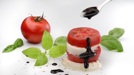 Sticker - Cinemagraph. Caprese salad with mozzarella and tomato and balsamic glaze