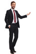 © Viorel Sima - businessman stands with hand in pocket and presents to side