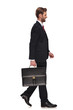 © Viorel Sima - side view of handsome businessman holding suitcase walking