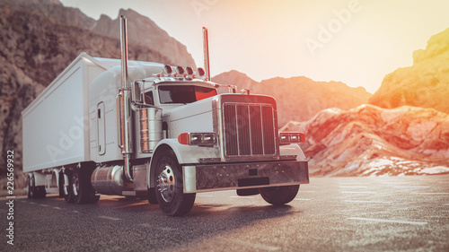 Cuadros en Lienzo A white truck running on the street in the morning.