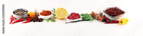 Fotomural Spices and herbs on table. Food and cuisine ingredients.