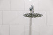 Chrome clean shower head in the bathroom