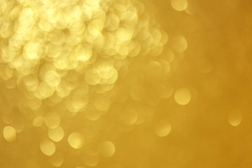 Golden bokeh illumination./ Abstract texture of defocused lights background