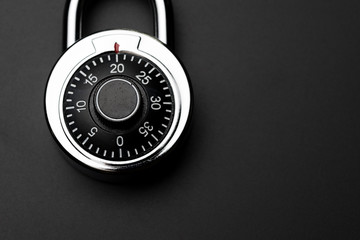 Aufkleber - code numbers on combination pad lock on dark black background with copy space, locking device in whi