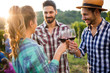 © NDABCREATIVITY - Wine tourists tasting wine in vineyard