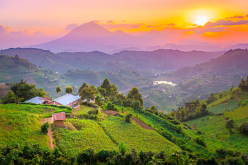 Kisoro Uganda beautiful sunset over mountains and hills of pastures and farms in villages of Uganda. Amazing colorful sky and incredible landscape to travel and admire the beauty of nature in Africa