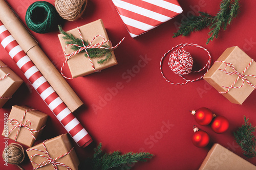 Christmas background with gifts and decorations on red. Preparation for holid...