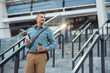 © LIGHTFIELD STUDIOS - smiling middle aged businessman with coffee to go and smartphone looking away on stairs