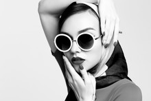 Young Woman In Retro Style. Sunglasses And Silk Scarf.