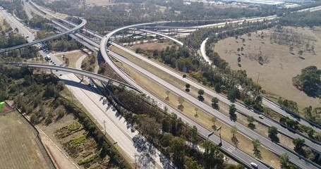 Canvas Print - Light Horse intercharge intersection between M4 and M7 motorways in Western Sydney – aerial landing down along multi-lane highway and traffic.
