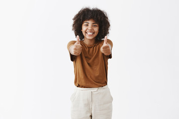 Wall Mural - saying yes to new opportunities. bright and joyful african american girl with afro hairstyle in styl