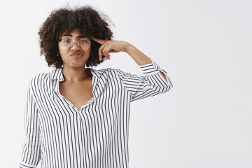 Wall Mural - waist-up shot of dispelased annoyed good-looking woman talking about strange and weird coworker roll
