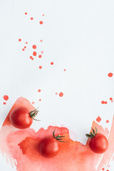 Wall Mural - top view of cherry tomatoes on white surface with red watercolor strokes and blots