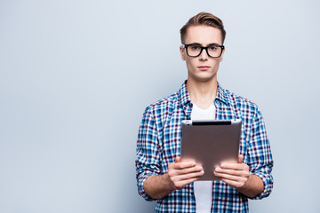 Portrait of cheerful man in checkered shirt look at camera stand