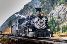 Vintage Steam Train Crossing A River In Colorado