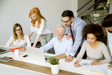 Wall Mural - Joyful multiracial business team at work in modern office