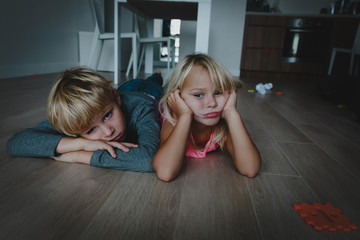 Wall Mural - kids bored at home, stressed tired exhausted boy and girl tired being inside