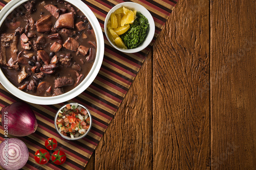 Cuadros en Lienzo Brazilian Feijoada Food. Top view with copy space.