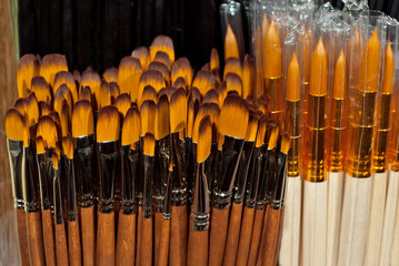 Wall Mural - Brushes for drawing on a shelf in a shop