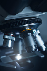 Wall Mural - close-up shot of modern microscope with sample slide at laboratory.
