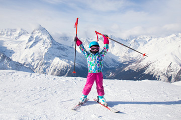 Wall Mural - little girl  in ski resort