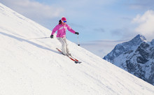 Woman Skiing  In The Mountains