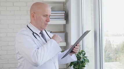 Wall Mural - Slow Motion with Doctor Writing a Medical Recipe in Interior of Dispensary Room